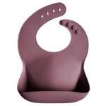 Bavoir en silicone Mushie Vieux Rose